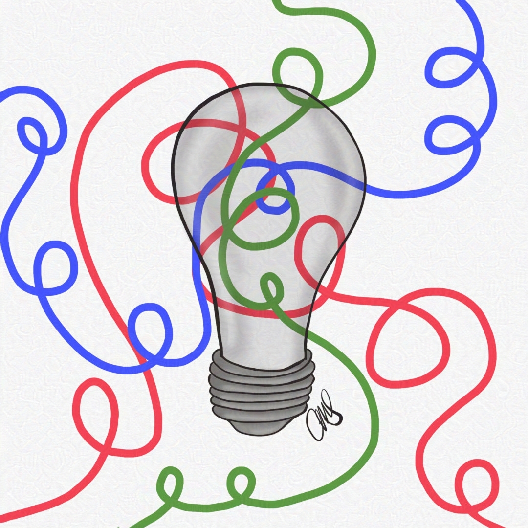 light bulb surrounded by red, green, and blue twisted wires.