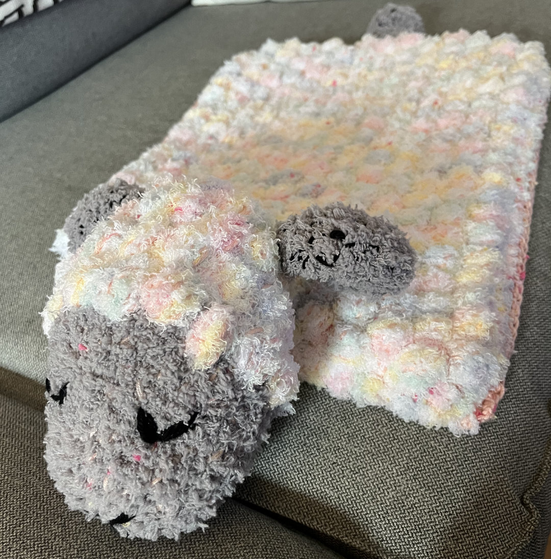 baby blanket with sheep head and tail attached for easy snuggling
